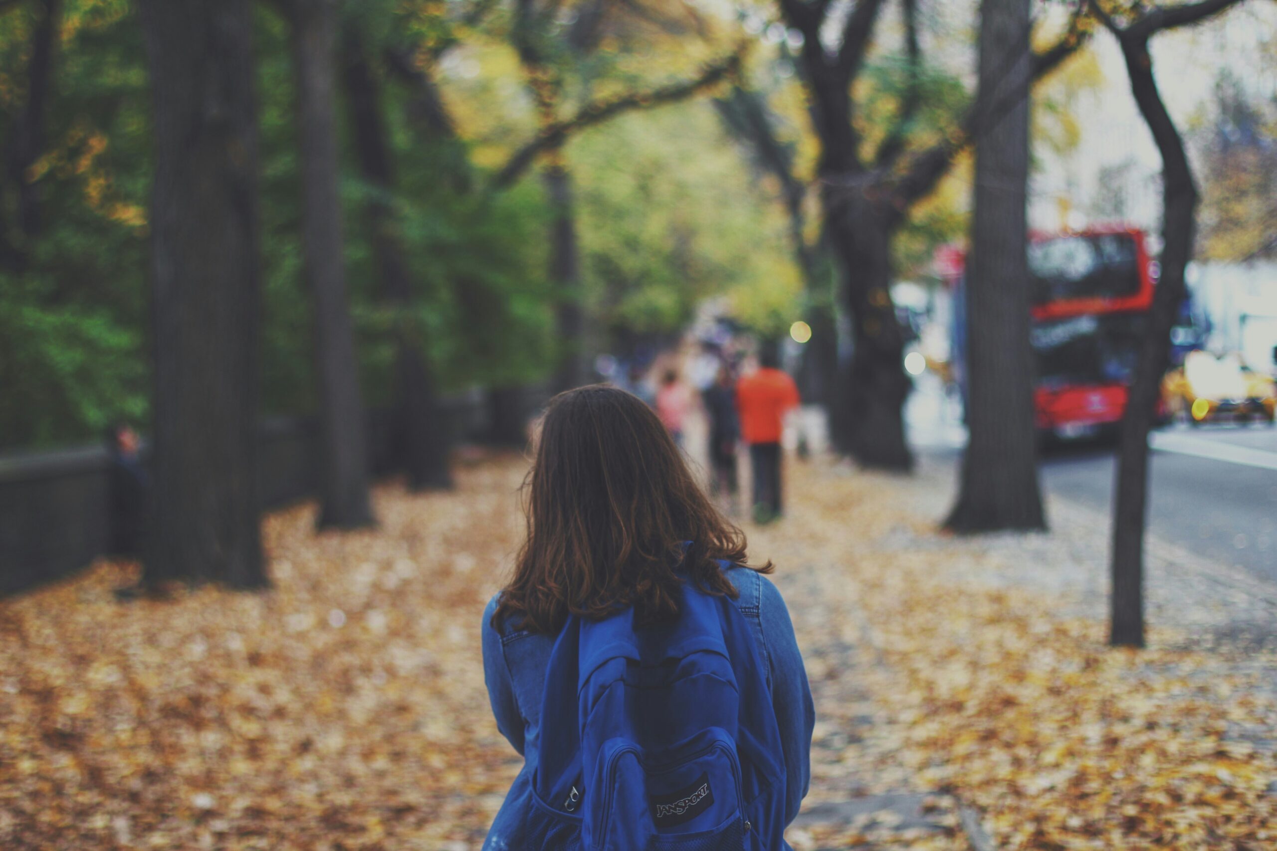 Young female walking to school with backpack