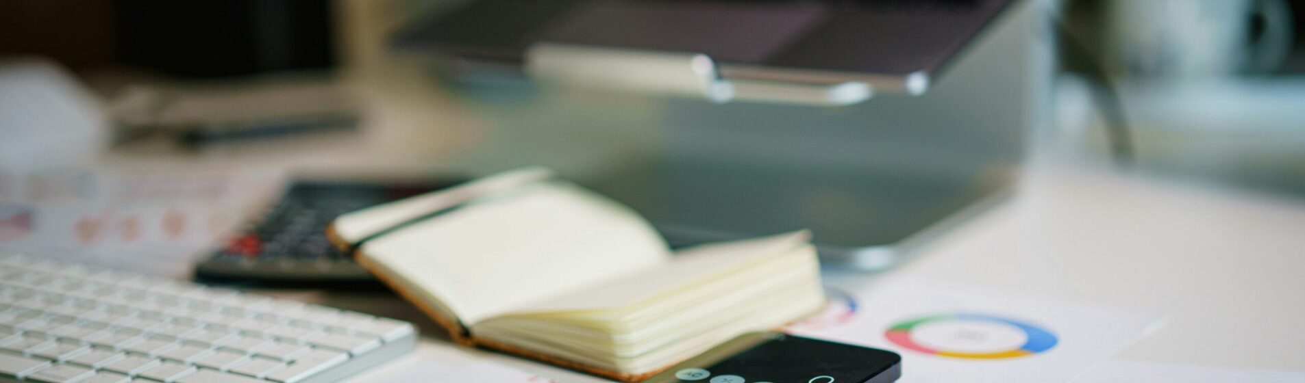Laptop, with calculators, paper