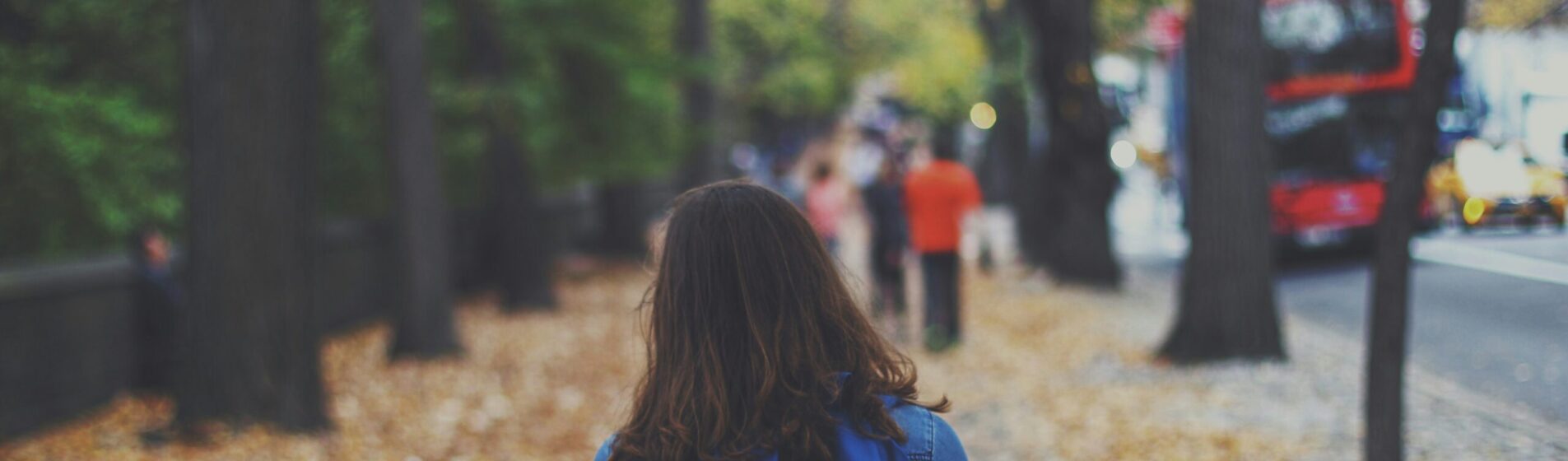 Young female walking to school with backpack